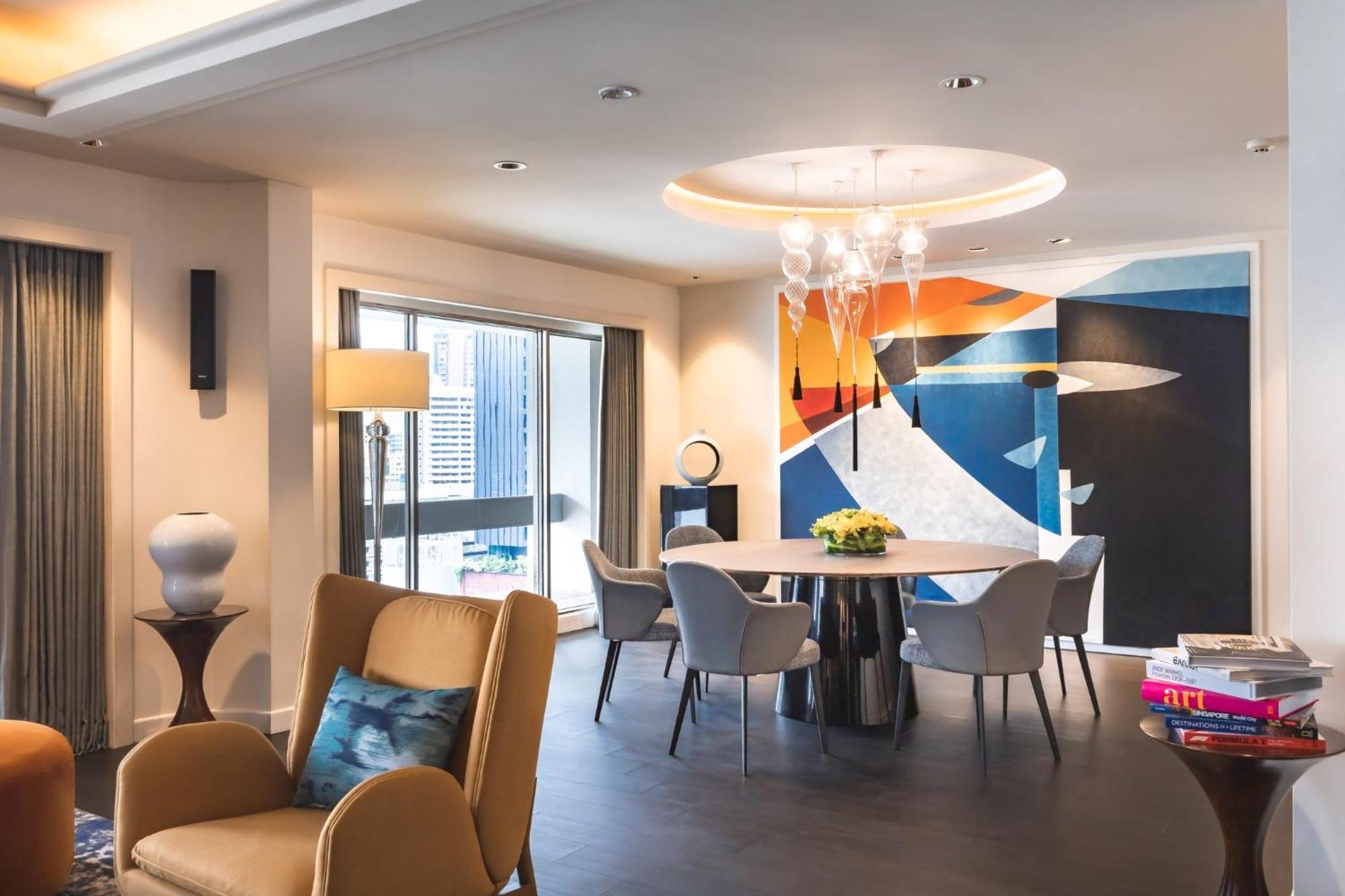 Voco Orchard Singapore By Ihg Экстерьер фото The dining room of a three-bedroom apartment at The Ritz-Carlton, Hong Kong